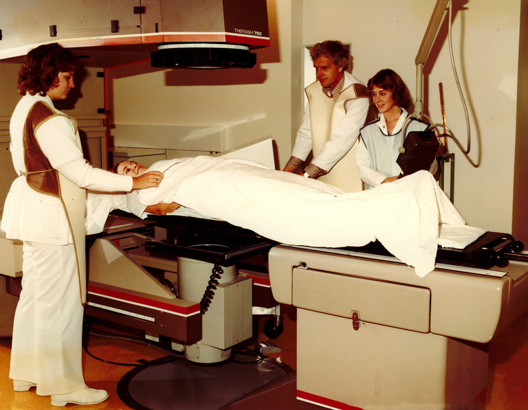 Image of Dr Larson and team wearing bibs while performing a fluoroscopy