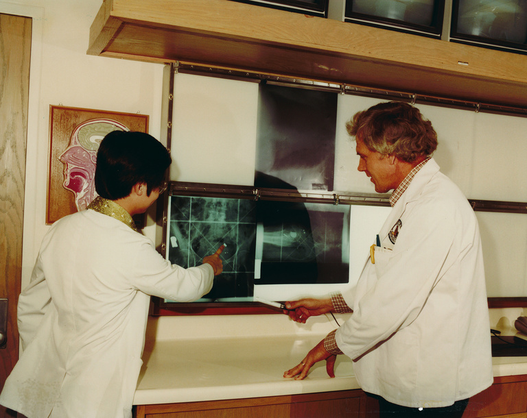 Dr Larson with an early portal image slide