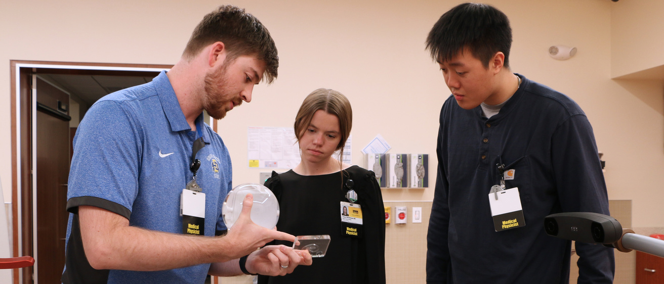 Medical Physics Residents inspect Gamma Knife Phantoms