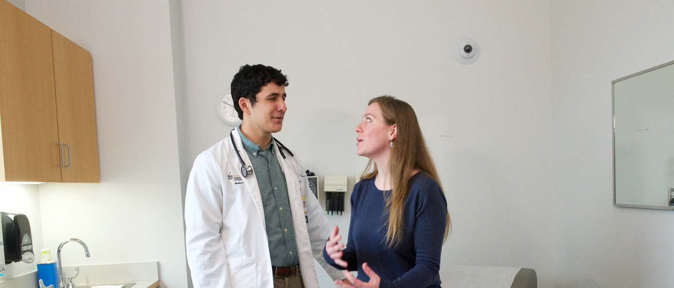 Medical student treating a patient