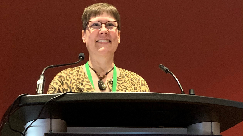 Carryn Anderson speaking at ASTRO 2022, cropped